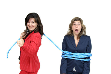 businesswoman boss with rope and team workersの写真素材
