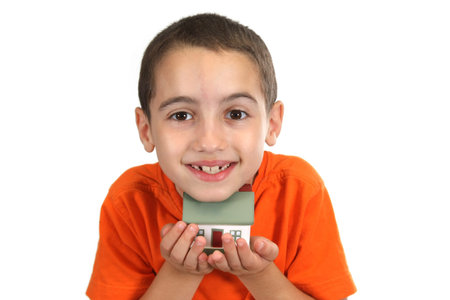 boy holdind a toy houseの写真素材