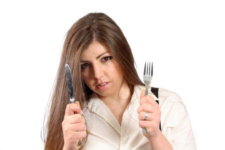 beautiful woman with knife and fork, food photoの写真素材