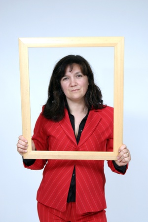 Portrait of a beautiful young woman with frameの写真素材