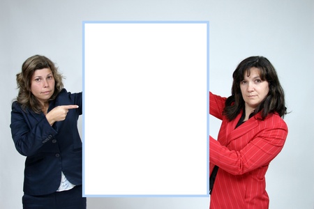 Young woman holding blank boardの写真素材
