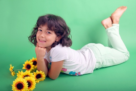 beautiful girl child with sunflowers, studio sessionの写真素材