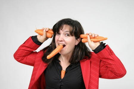 woman with carrots, healthy food, health conceptの写真素材