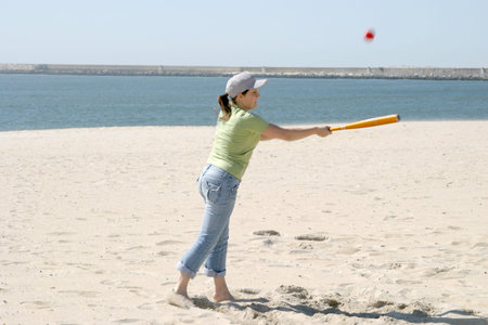 playing baseball on the beach, sports photo