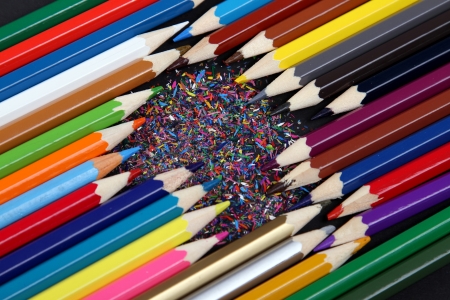 Assortment of coloured pencils with shadow on white/black backgroundの写真素材