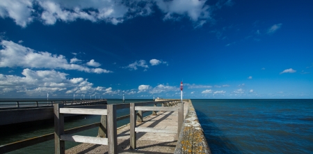 pontoon jetty and channel of grandcamp normandyの写真素材