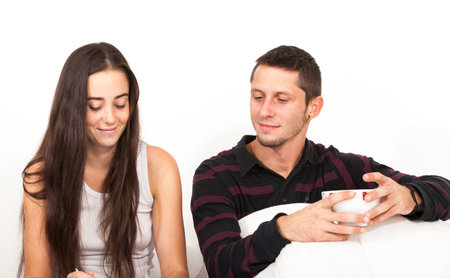 a man and a woman breakfast in bedの写真素材