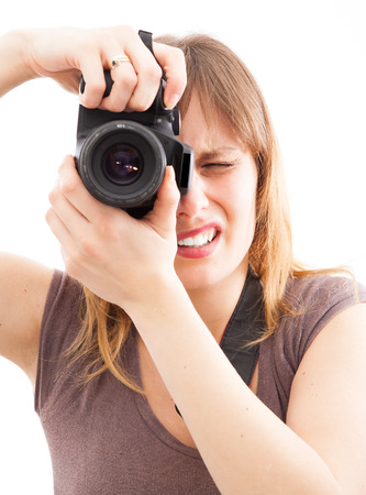  young woman using a camera to take photo の写真素材