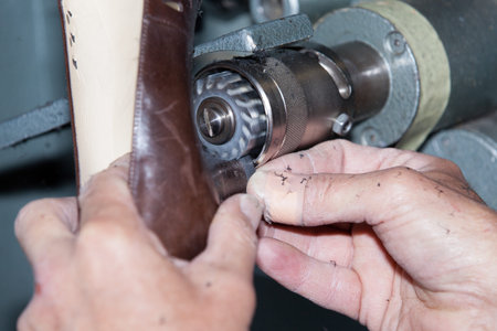 the shoemaker repairs a shoe