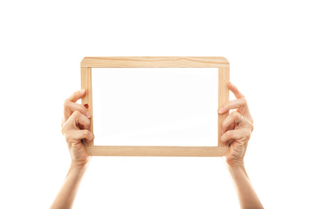 female hands holding a blackboard chalkboardの写真素材