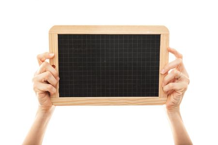 female hands holding a blackboard chalkboardの写真素材