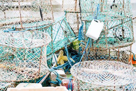 crab and lobster pots on a pontoon covered with morning frostの写真素材