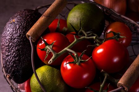 poster of an old basket with onion garlic tomatoes to decorate the kitchenの写真素材