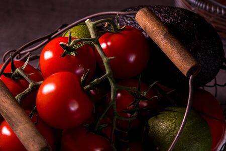 poster of an old basket with onion garlic tomatoes to decorate the kitchenの写真素材