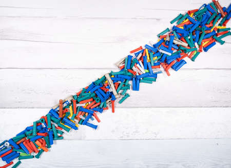 Set of different dowels for wood, concrete, plaster on an old wooden background. top view.の写真素材