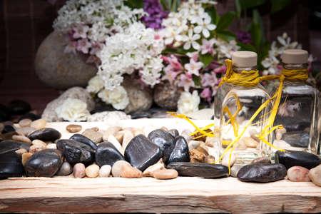 Aromatherapy, spa, beauty treatment and wellness background with massage stone, flowers, flacon .. spa conceptの写真素材