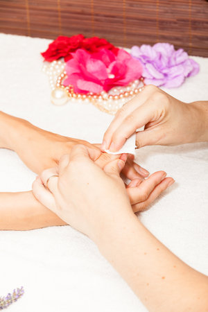 Manicure of nails from a woman's hands before applying nail polishの写真素材