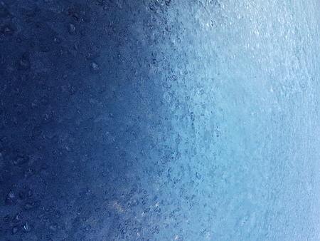 Frost Pattern on Frozen Glass Focused on Foregroundの写真素材