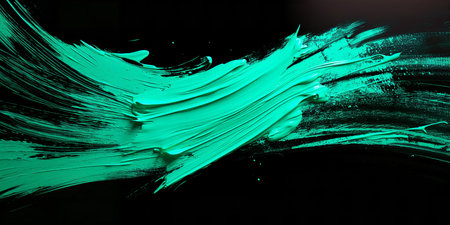 Teal green paint brush strokes on a black background, closeup of photoの素材