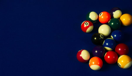 Sequence of black pool ball direct to the rest of the balls of the pool table, including the white oneの写真素材
