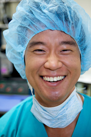 An Asian Doctor Working in a Hospitalの写真素材