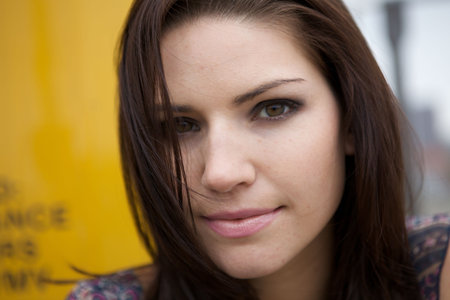 An Edgy Brunette with a yellow backroundの写真素材