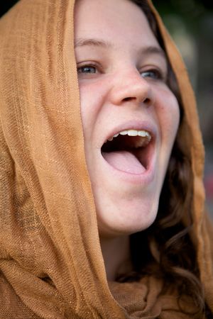 A Beautiful Girl with a cloth hood and green eyesの写真素材