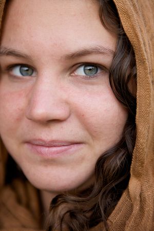 A Beautiful Girl with a cloth hood and green eyesの写真素材