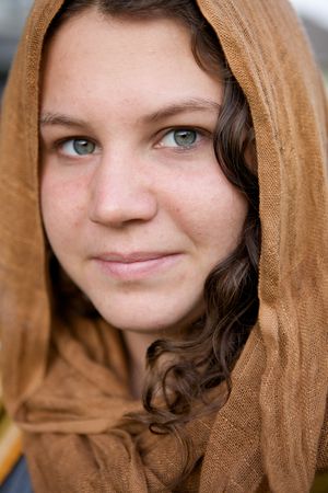 A Beautiful Girl with a cloth hood and green eyesの写真素材