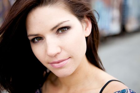 Beautiful Brunette with an edge and darker eye makeupA Sexy Brunette Looking Toward The Camera with an edgy lookの写真素材