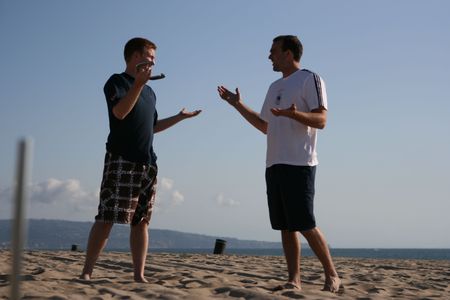 Playing horshoes at the beach in the sandの写真素材