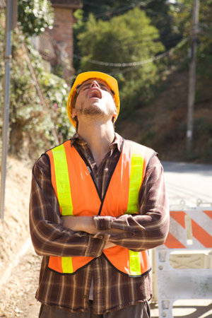 A Bored Construction Worker with his head back