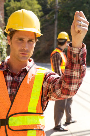 A Construction Worker on the job with a hard hatの写真素材