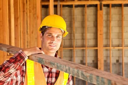 A Construction Worker on the job with a hard hatの写真素材