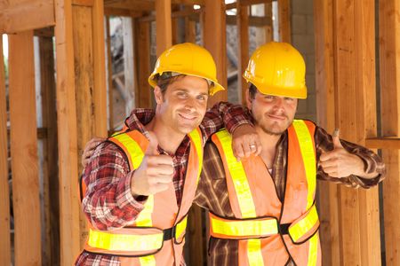 Two Construction Workers at the job working togetherの写真素材
