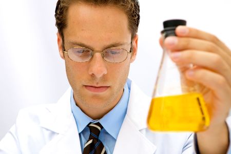 A male scientist working in a lab with glassesの写真素材