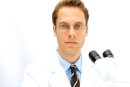 A male scientist working in a lab with glassesの写真素材