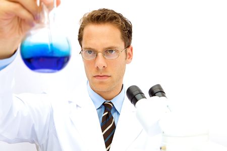 A male scientist working in a lab with glassesの写真素材