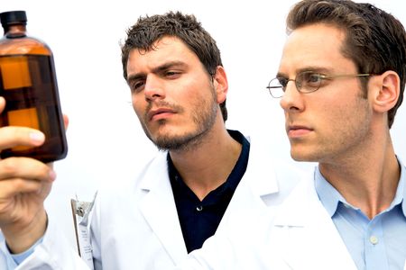 Two Scientists working together one with a blue shirtの写真素材