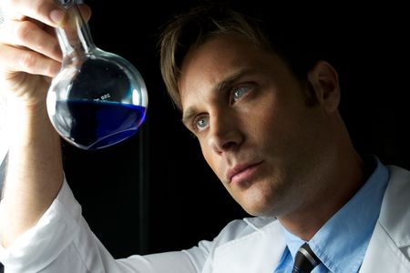 A young scientist conducting an experiment in a labの写真素材