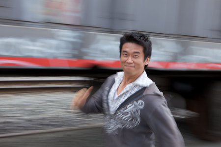 A funny motion blur of an asian man runningの写真素材