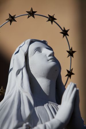 A Praying Virgin Mary Statue with stars haloの写真素材