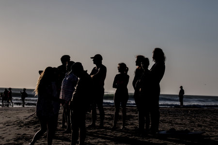Young people watching the sunsetの写真素材