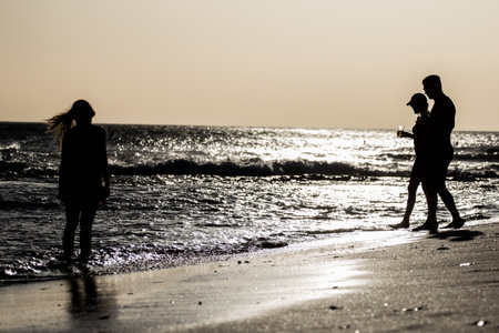 Young people watching the sunsetの写真素材