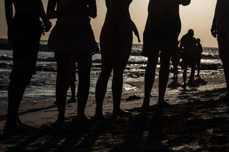 Young people watching the sunsetの写真素材