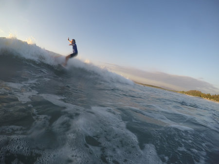 Tamarindo, Costa Rica - People surfing off the beachの写真素材