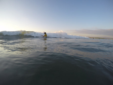 Tamarindo, Costa Rica - People surfing off the beachの写真素材