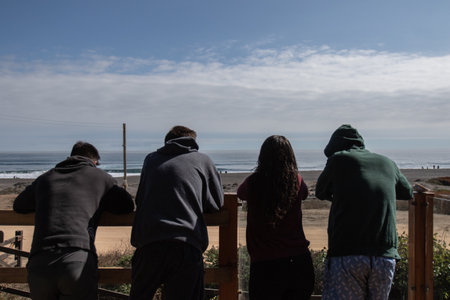 group of friends looking out on beautiful summer day, Pichilemu Chile, Outdoor, travelの写真素材