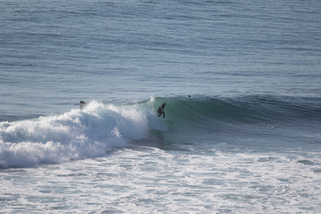 Pichilemu, O'Higgins Region, Chile: Surfer at Punta de Lobos a surfing beach at the south of Pichilemu. Outdoorの写真素材