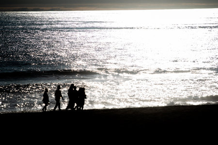 A sunset over a body of water and shadow, Pichilemu, Chileの写真素材